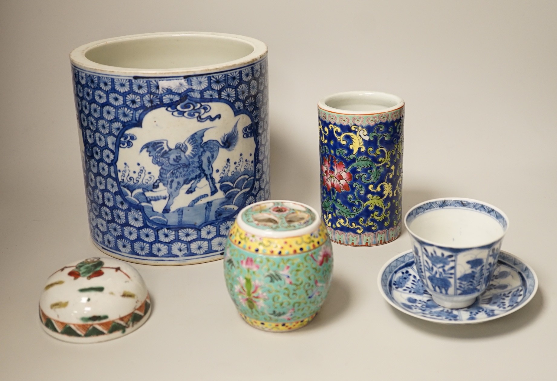 A Chinese blue and white brushpot, enamelled jar, brush pot, famille verte jar cover and a Japanese blue and white tea bowl and cover. Tallest 18cm